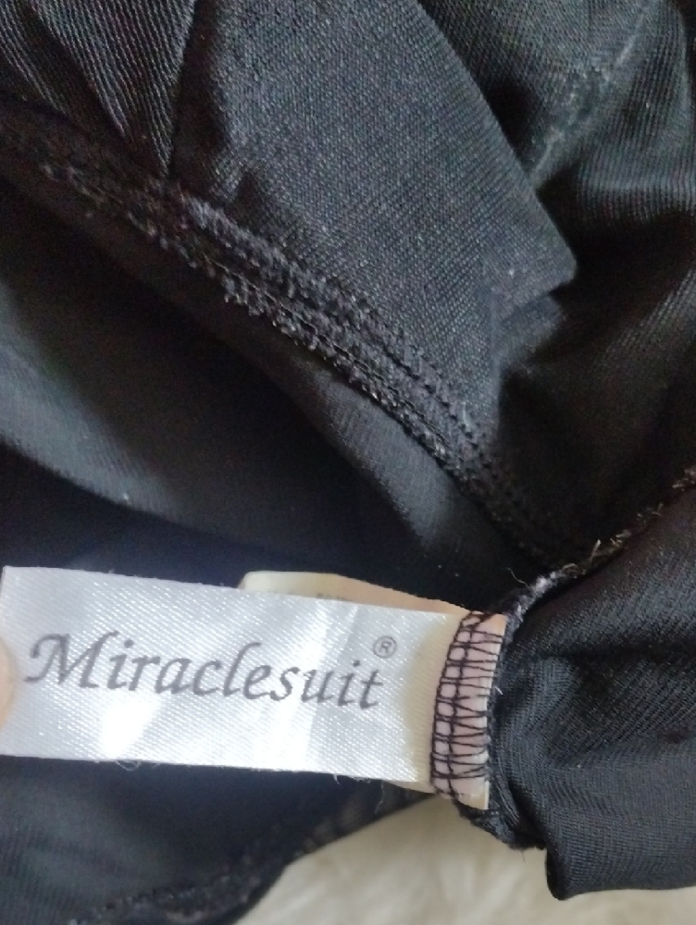Miraclesuit Black One-Piece Swimsuit with Silver Tag Detail - Picture 2 of 6